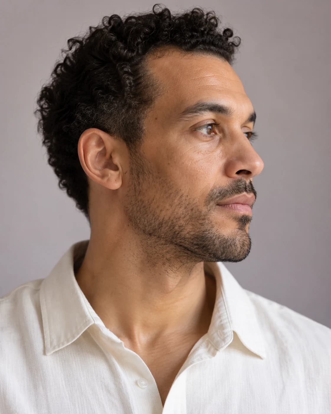 Editorial side profile showing a man's natural jaw and neck