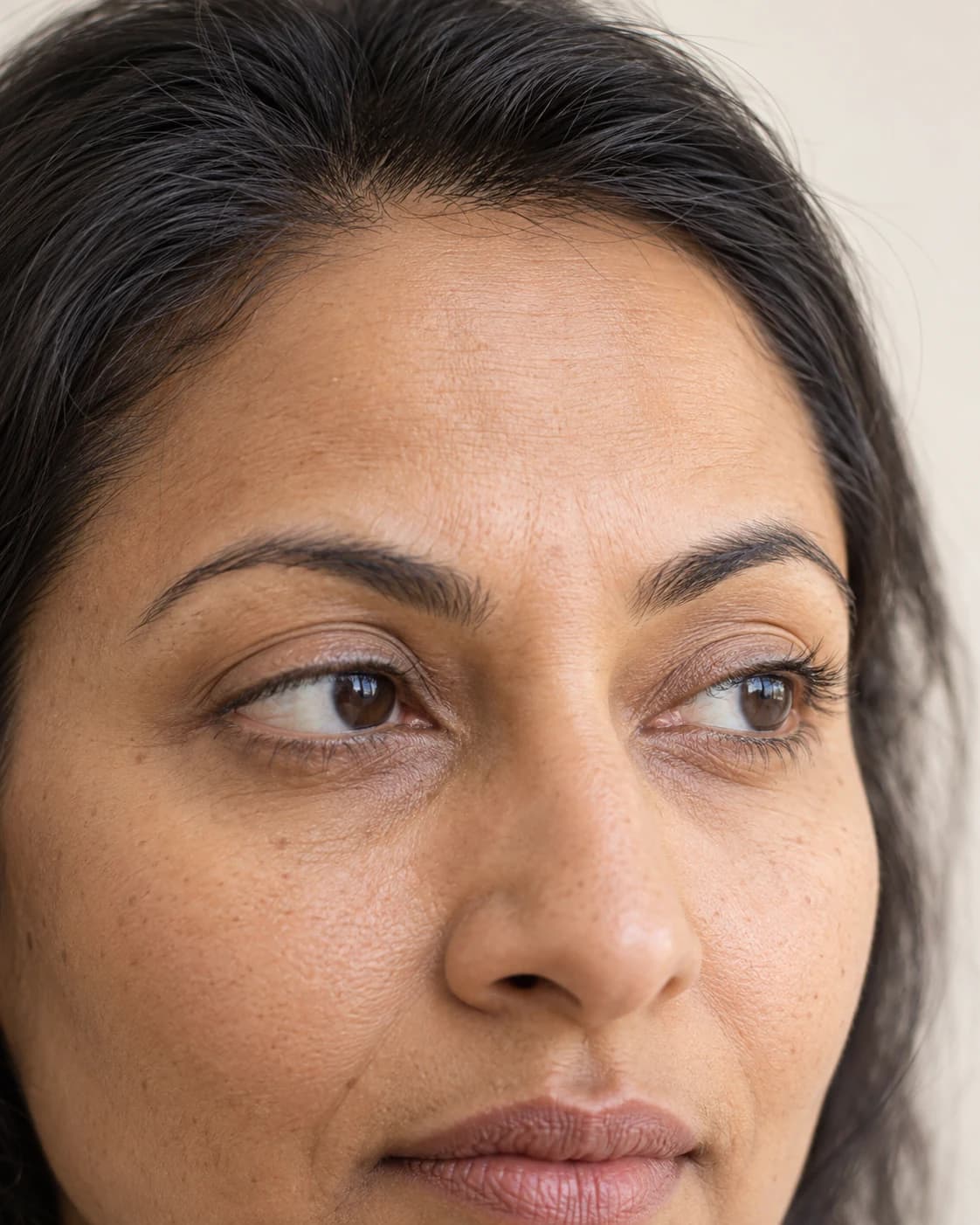 Editorial close-up of natural eyes and under-eye skin